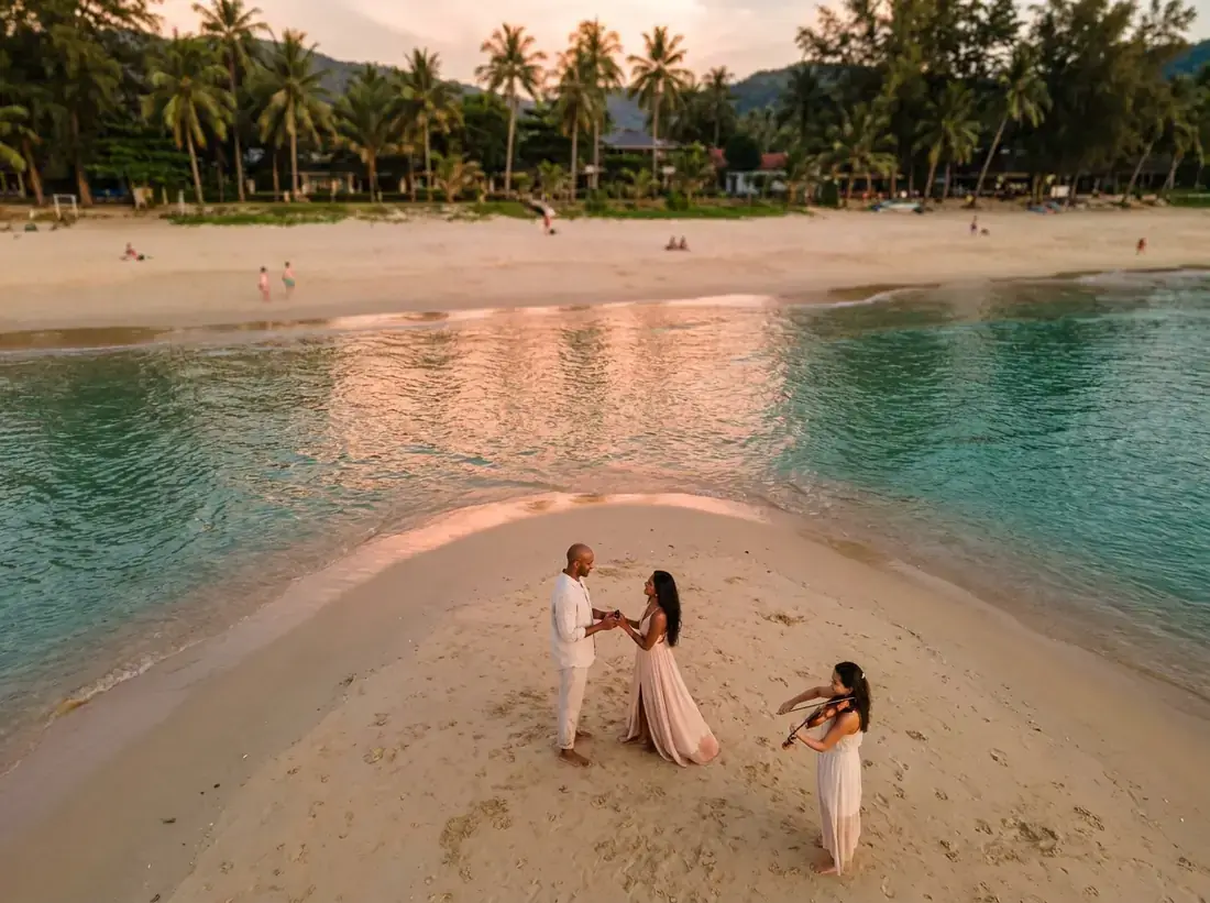 Aerial view of Surin Beach, Phuket, Thailand for a violinist musician beach sunset proposal couple live music
