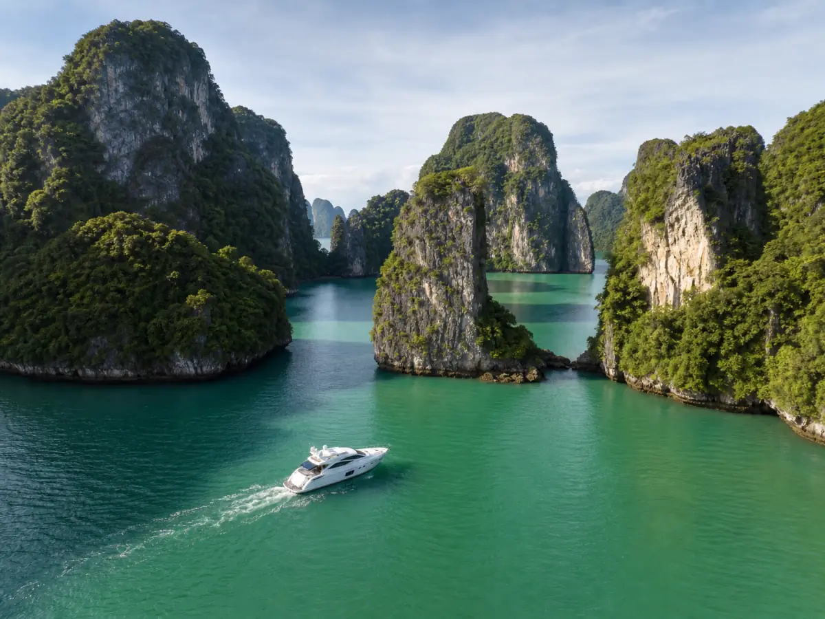 Private yacht among limestone islands in Phang Nga Bay, Thailand